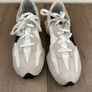 New Balance 327 sneakers in black on white